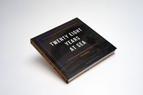 Hardcover photography coffee table book with matte lamination showcasing vibrant big-wave surfing images