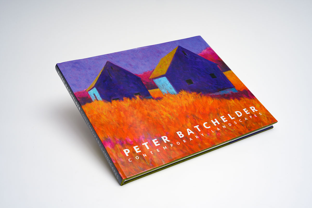 Hardcover coffee table art book with fabric cloth cover, foil stamping, and dust jacket showcasing vibrant oil paintings