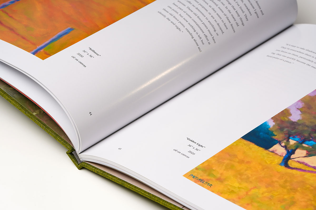 Close-up of coffee table art book gutter highlighting precision binding and seamless page alignment for oil painting reproductions