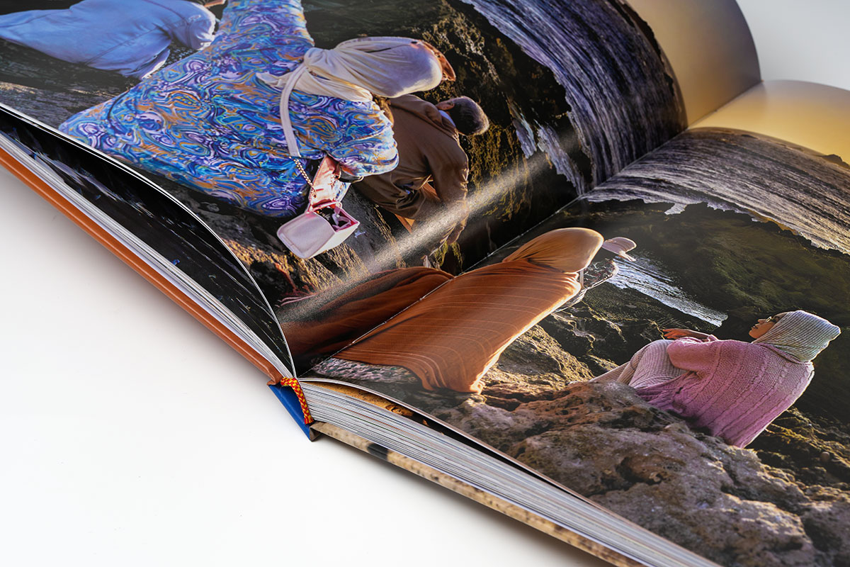 Close-up of a travel photography coffee table book gutter highlighting precision binding and seamless page alignment