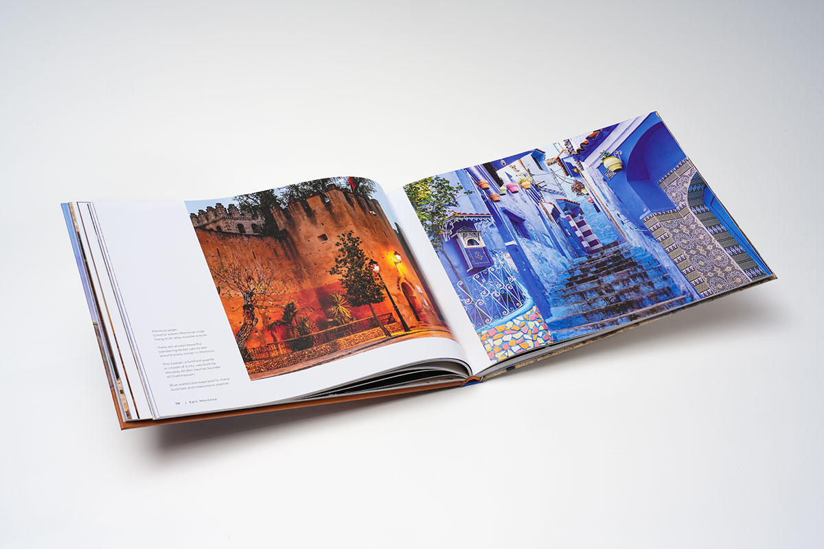 Interior pages of a travel photography coffee table book with sharp Moroccan landscape and cultural image reproduction on matte 105lb paper