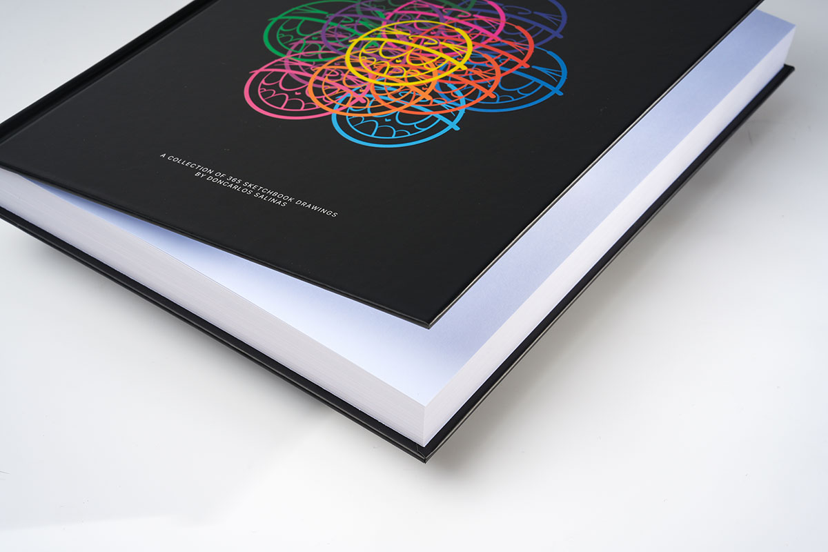 Lifted cover of a sequential art sketchbook revealing 3.5mm thick cover board and high-quality matte finish