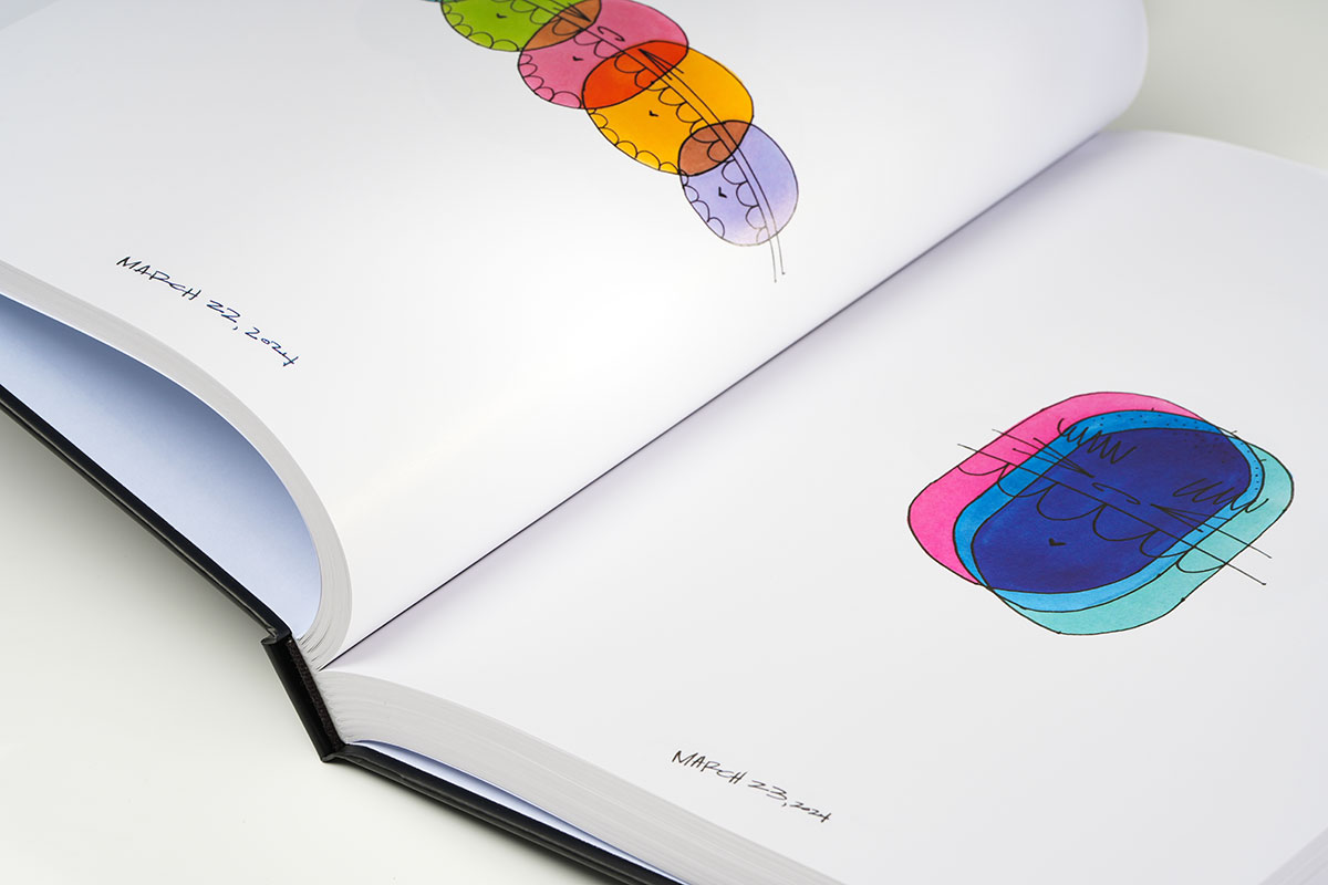 Close-up of a sequential art sketchbook gutter highlighting precision binding and seamless page alignment