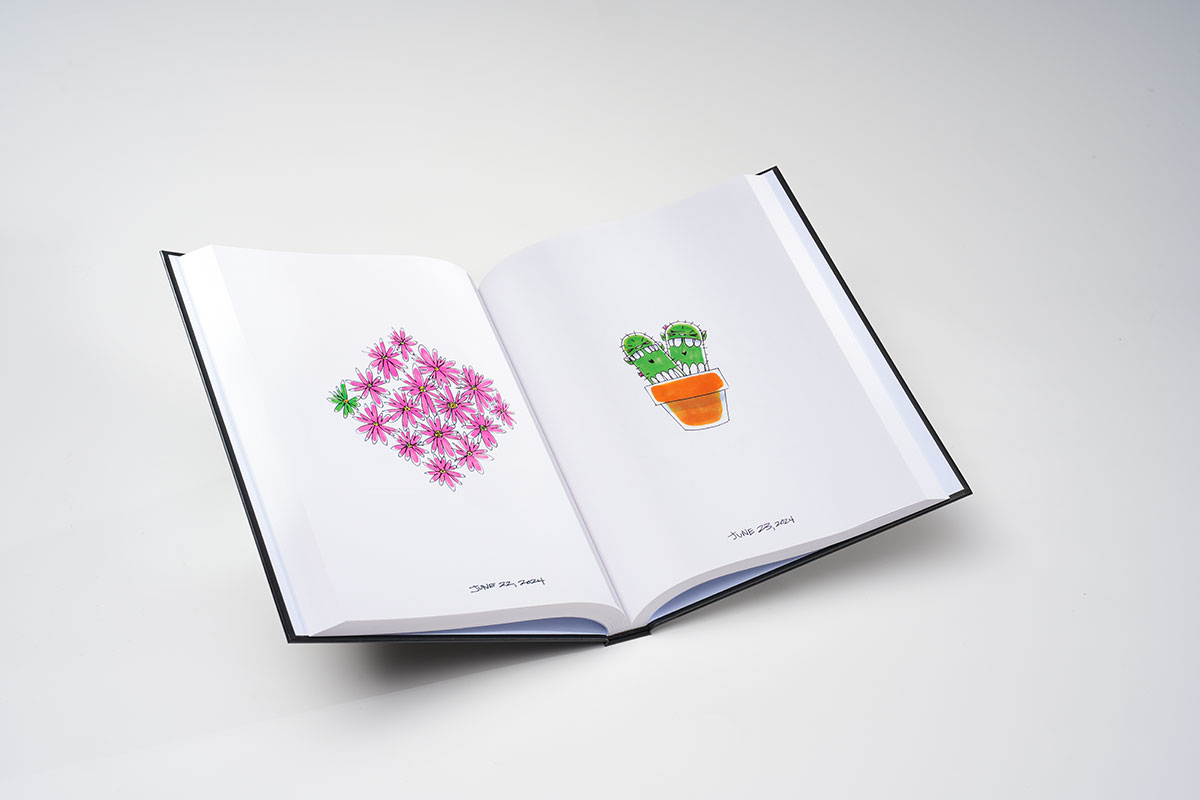 Interior pages of a sequential art sketchbook with sharp smiley face illustration reproduction and rich color quality on matte 85lb paper