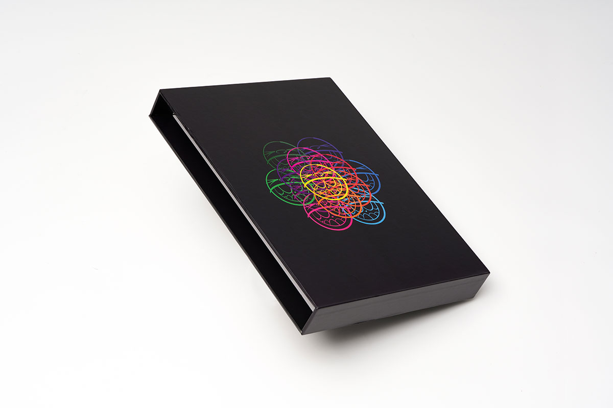 Flat-lay view of a hardcover sequential art sketchbook in 8.25x11 format with matte finish and high-quality printing