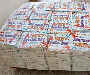 Finished board books stacked on a pallet for shipping