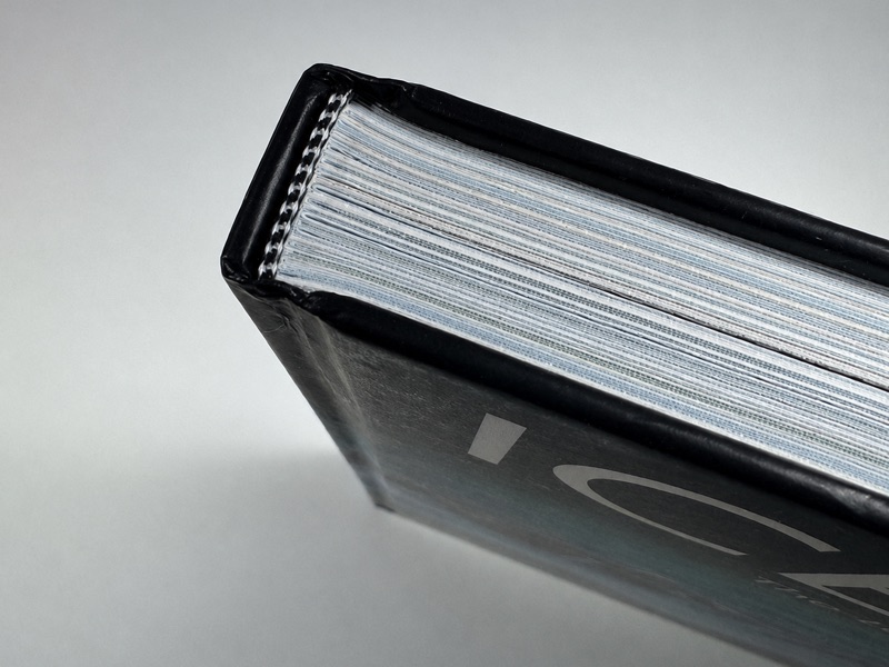 Black and white headband at the top of a hardcover book spine