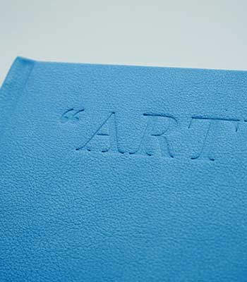 Detailed view of debossing on an art book cover