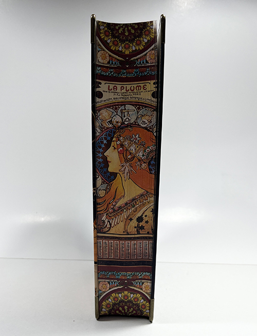 Book spine with colorful spray edge painting featuring an artistic illustration and decorative patterns.