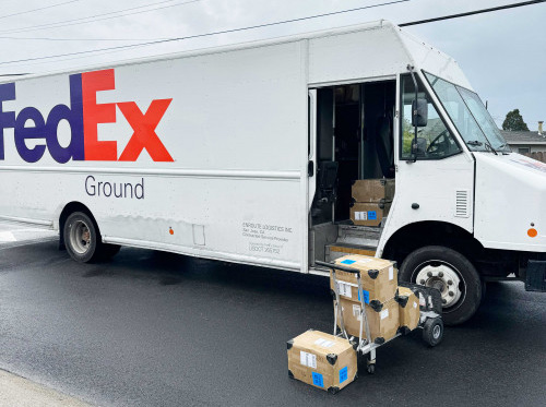 FedEx Ground Truck with Book Shipment Boxes Ready for Delivery