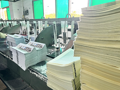 Perfect bound softcover production line with stacked printed interiors