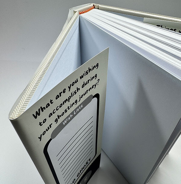 A cloth cover planner protected by a matte laminated dust jacket