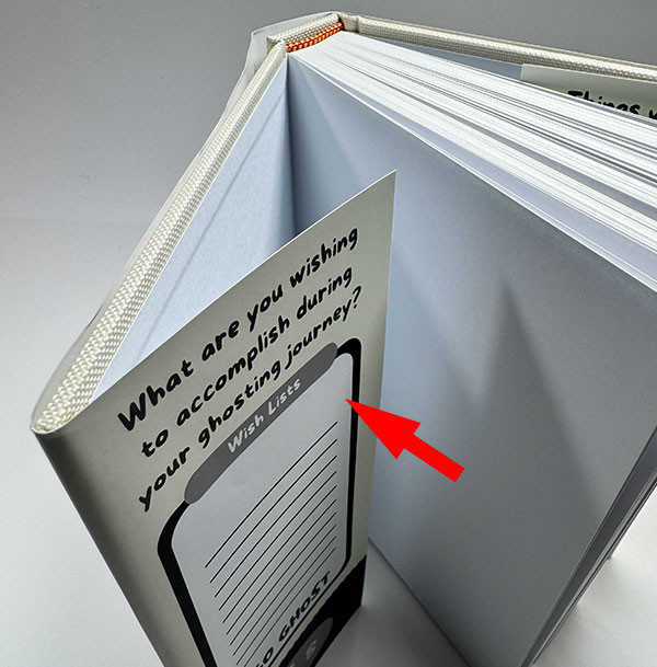 An arrow pointing to the flap of a dust jacket