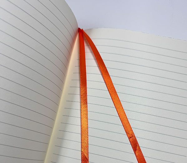 A notebook featuring two ribbon markers