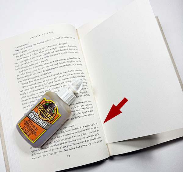 A sheet of paper about to be glued into the book as the tip-in page